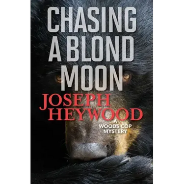 Chasing a Blond Moon: A Woods Cop Mystery