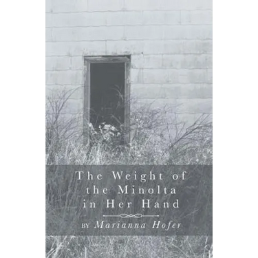 The Weight of the Minolta in Her Hand
