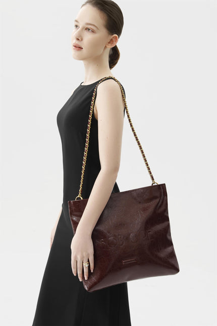 Rei Leather Bag, Red Wine by Bob Oré