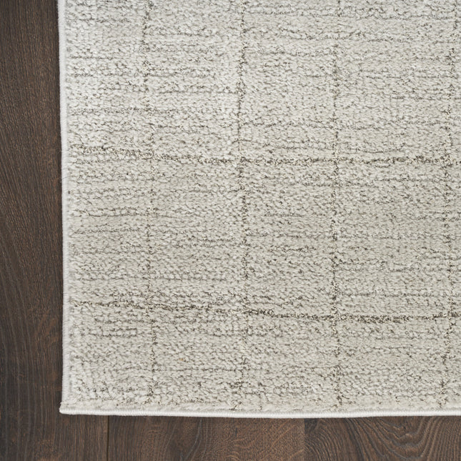 8' x 10' Beige and Ivory Abstract Power Loom Area Rug